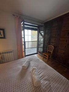 Кровать или кровати в номере Bonito apartamento Incles by Renttarter
