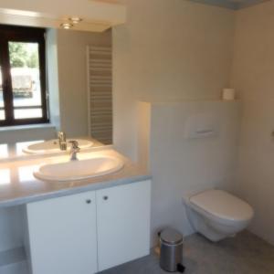 a bathroom with a sink and a toilet at Le Gardy in Arques