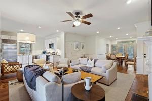 a living room with a couch and a ceiling fan at 5 Silver Moss in Kiawah Island