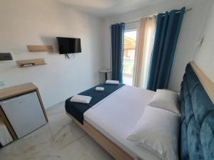 Postel nebo postele na pokoji v ubytování Hotel Vathi