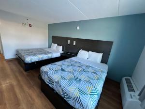 Postel nebo postele na pokoji v ubytování Motel 6 East Syracuse, NY - Airport