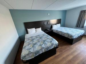 Postel nebo postele na pokoji v ubytování Motel 6 East Syracuse, NY - Airport