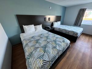 Postel nebo postele na pokoji v ubytování Motel 6 East Syracuse, NY - Airport
