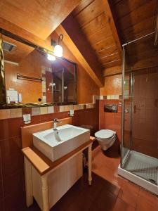 a bathroom with a sink and a toilet at Kallisti Luxury rooms in Nafplio +26 photos