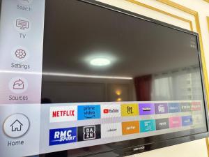 a television screen with different signs on it at SCI IMMO PARIS PORTE DE CHOISY in Paris +4 photos
