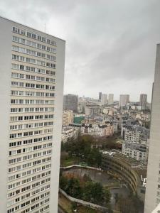 a view of a city from a tall building at SCI IMMO PARIS PORTE DE CHOISY in Paris +2 photos