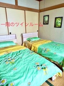 Llit o llits en una habitació de PENSION YunShuiYao雲水瑶民宿