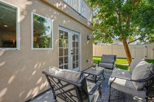 a patio with chairs and a table next to a house at Captivating 2 Bedroom House W Bbq Near Beach in Los Angeles