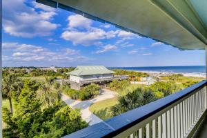 an oceanfront balcony with a view of the beach at 309A Sea Cabin in Isle of Palms