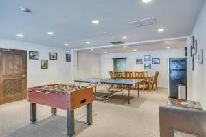 a room with two ping pong tables and a ping pong table at Remodeled Vail Condo with Hot Tub Access! in Vail