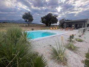 a swimming pool in the middle of a field at Increíble Rancho en Huamantla in Huamantla