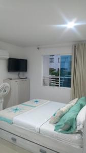 En eller flere senger på et rom på 303 El Rodadero, Apartamento Familiar , piscina , parqueadero