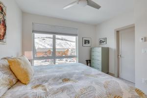 a bedroom with a large bed and a window at Silverthorne Mountain Retreat Near A-Basin! in Silverthorne