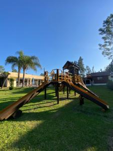 a playground with a slide in a park at Complejo Tajamar in Colón