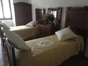 Ліжко або ліжка в номері Casa di Emanuela