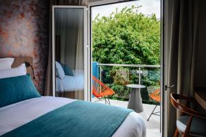Sable Bleu Boutique Hotel客房内的一张或多张床位
