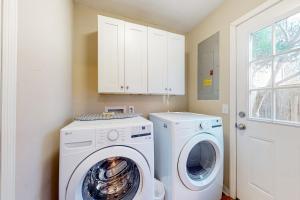 a laundry room with a washer and dryer at Maple Leaves - 30 Day Rental in Charleston