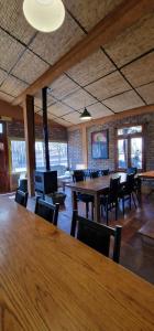 a large room with tables and chairs in a building at Uspallata Suites in Uspallata