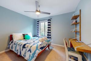 a bedroom with a bed and a window at Maple Leaves - 30 Day Rental in Charleston