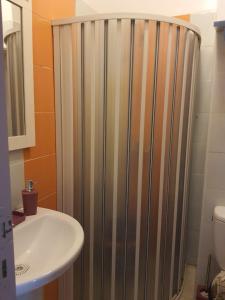 a bathroom with a shower next to a sink at APPARTEMENT sofia Haymohameddi in Agadir