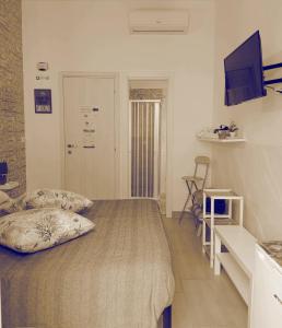 Televízia a/alebo spoločenská miestnosť v ubytovaní B&B Il Castello