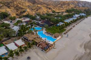 an aerial view of a resort on the beach at Punta Sal Suites & Bungalows Resort in Canoas De Punta Sal