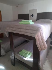 Una cama o camas en una habitación de Hosteria Catalina
