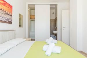 Кровать или кровати в номере Casa D'Amare
