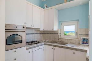 Кухня или мини-кухня в Casa D'Amare
