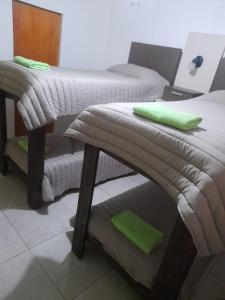 Ein Bett oder Betten in einem Zimmer der Unterkunft Hosteria Catalina