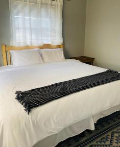 Un pat sau paturi într-o cameră la Pule's Home