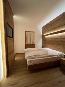 Łóżko lub łóżka w pokoju w obiekcie Chalet Baita del Sole