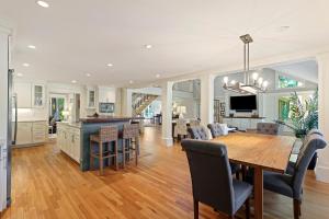 a dining room and kitchen with a table and chairs at 335 Winged Foot in Kiawah Island