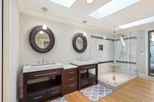 a bathroom with two sinks and a shower at 335 Winged Foot in Kiawah Island