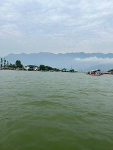 a large body of water with boats in it at Houseboat Bendmeer Heritage in Srinagar