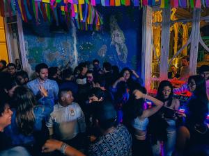 a crowd of people dancing in a club at Viajero Kokopelli Lima - Barranco Hostel in Lima