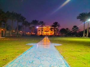 a house in the middle of a field at night at Tunis Beach Families Only in Fayoum Center