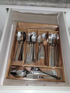 a drawer filled with spoons and forks and spoonsktop at Big new house with huge parking in West Seneca