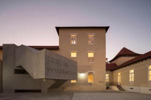 a building with a sign on the side of it at Porto 3 Bedroom Beach Apartment in Matosinhos