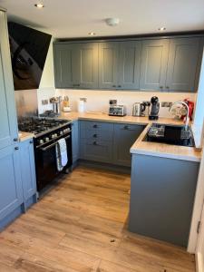 Kuchyň nebo kuchyňský kout v ubytování The Ship Inn's Mill Cottage - Weavers Way