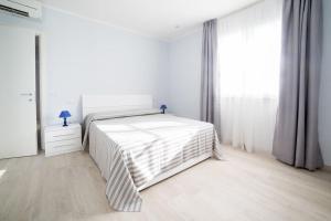 A bed or beds in a room at Home by Massi
