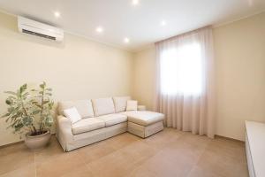 A seating area at Home by Massi