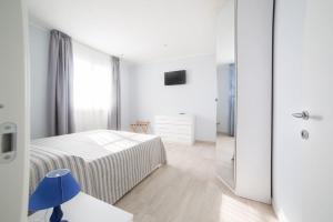 A bed or beds in a room at Home by Massi
