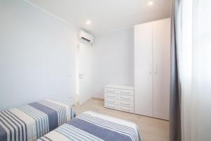A bed or beds in a room at Home by Massi