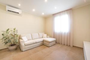 A seating area at Home by Massi