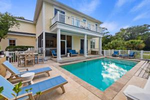a swimming pool in front of a house at 2482 High Hammock Road in Seabrook Island