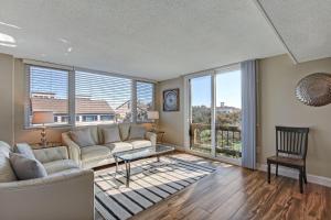 a living room with a couch and a table at 1172 Beach Walker in Amelia Island