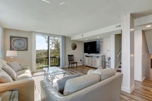a living room with a couch and a table at 1172 Beach Walker in Amelia Island