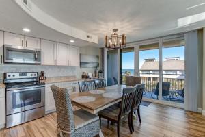 a kitchen with a table and chairs and a dining room at 1172 Beach Walker in Amelia Island