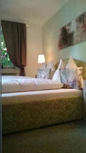 Łóżko lub łóżka w pokoju w obiekcie Gasthof Krisplwirt
